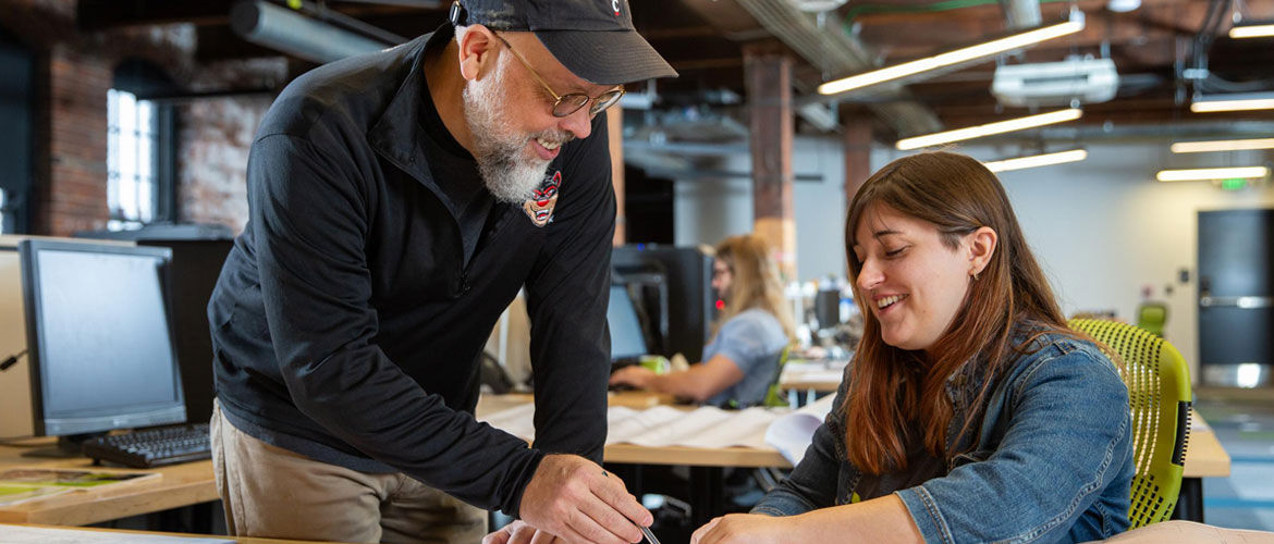 UC student working with co-op employer at her summer internship at an architecture firm